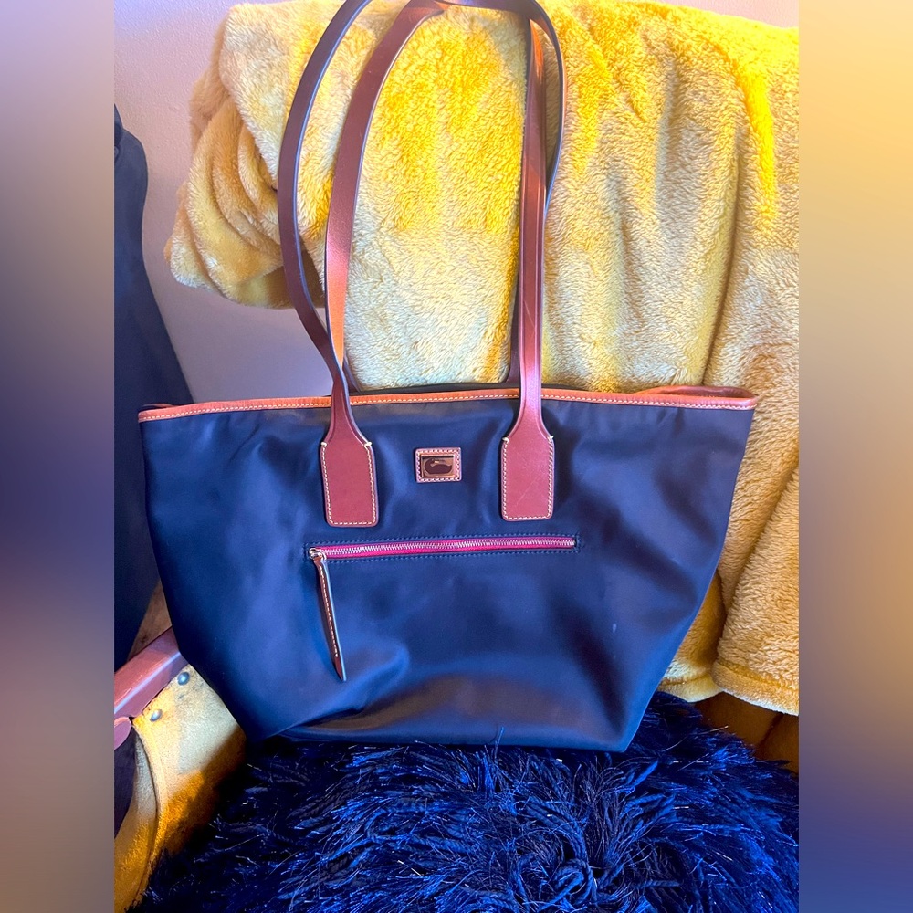 All weather black Dooney and Burke shoulder bag.